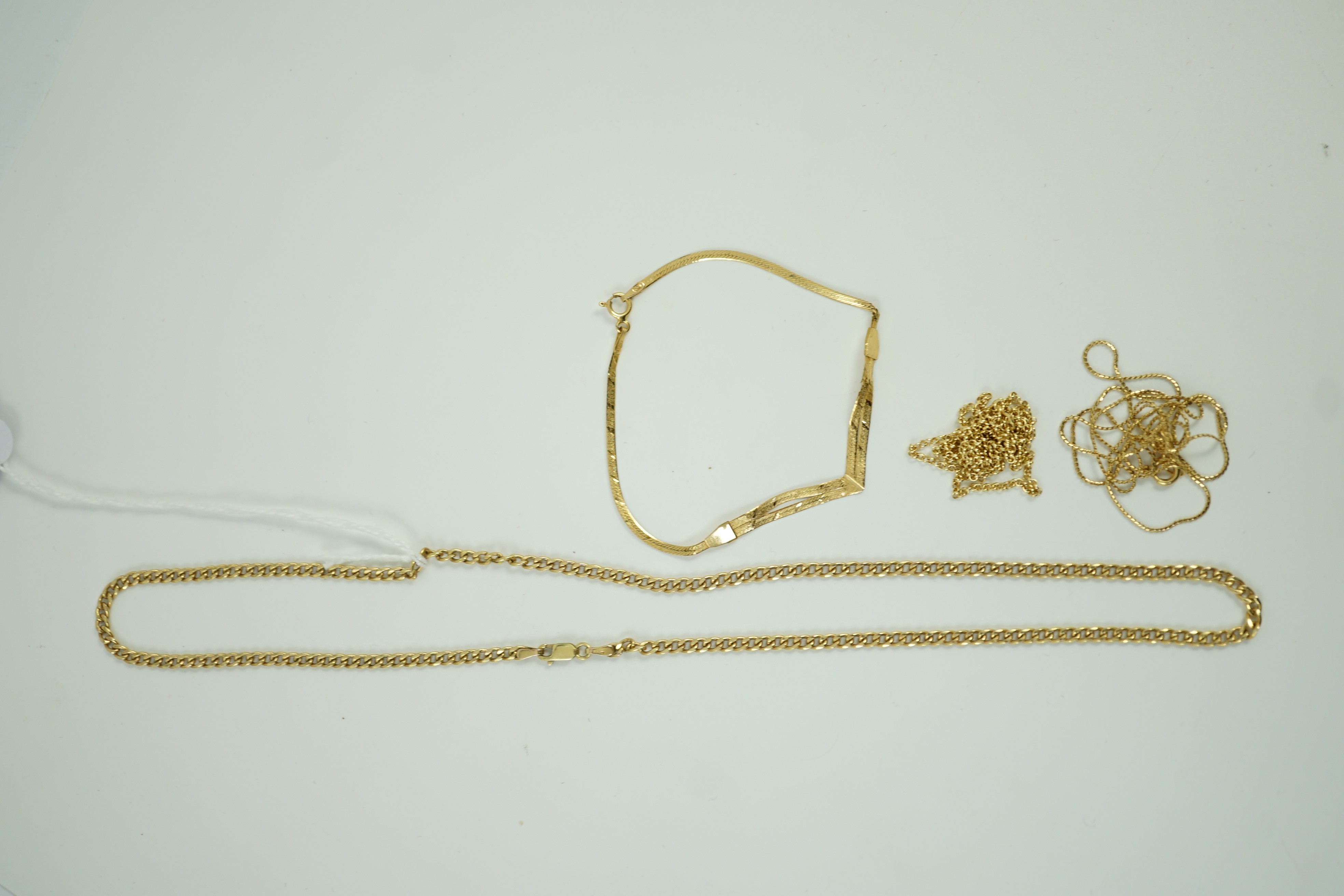 Two modern 9ct gold chains, longest 45cm, 6 grams, a 14kt bracelet, 1.6 grams and a 750 fine link chain, 2.3 grams.